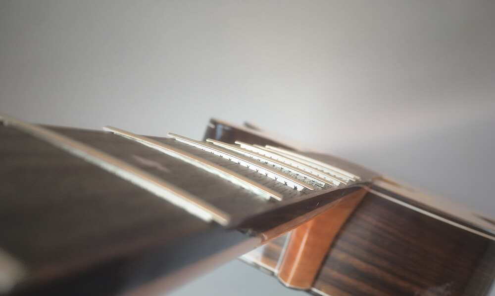 fret wires perfectly tapped into fingerboard